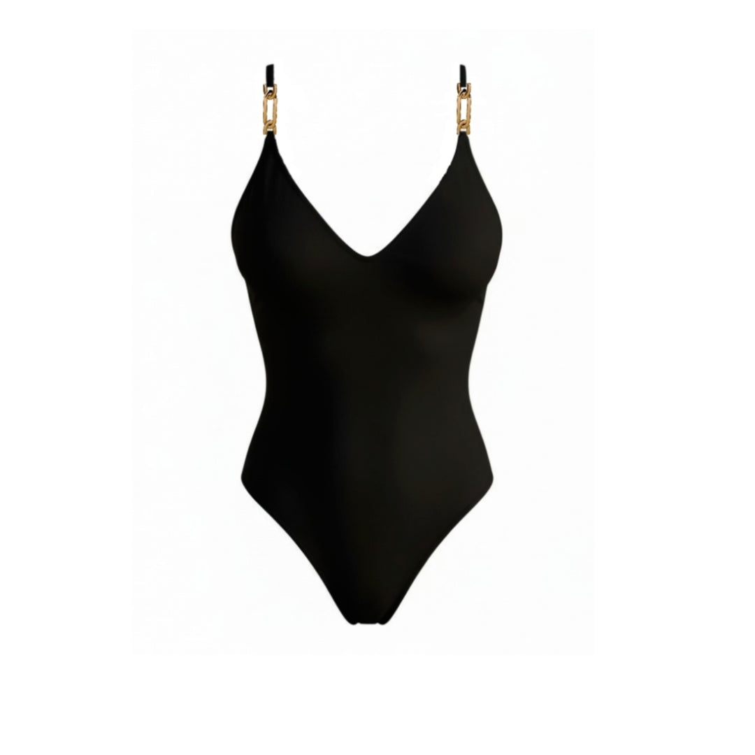 Bañador negro Kelly con escote en V y detalle dorado en los tirantes, vista frontal en fondo neutro