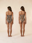 Back view of leopard one-shoulder swimsuit showing classic and Brazilian coverage comparison, Nora Chantre Swimwear