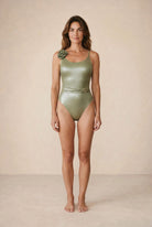 Front view of the Elara crocodile texture swimsuit with belt by Nora Chantre.