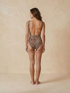 Back view of leopard print swimsuit by Nora Chantre with classic coverage.