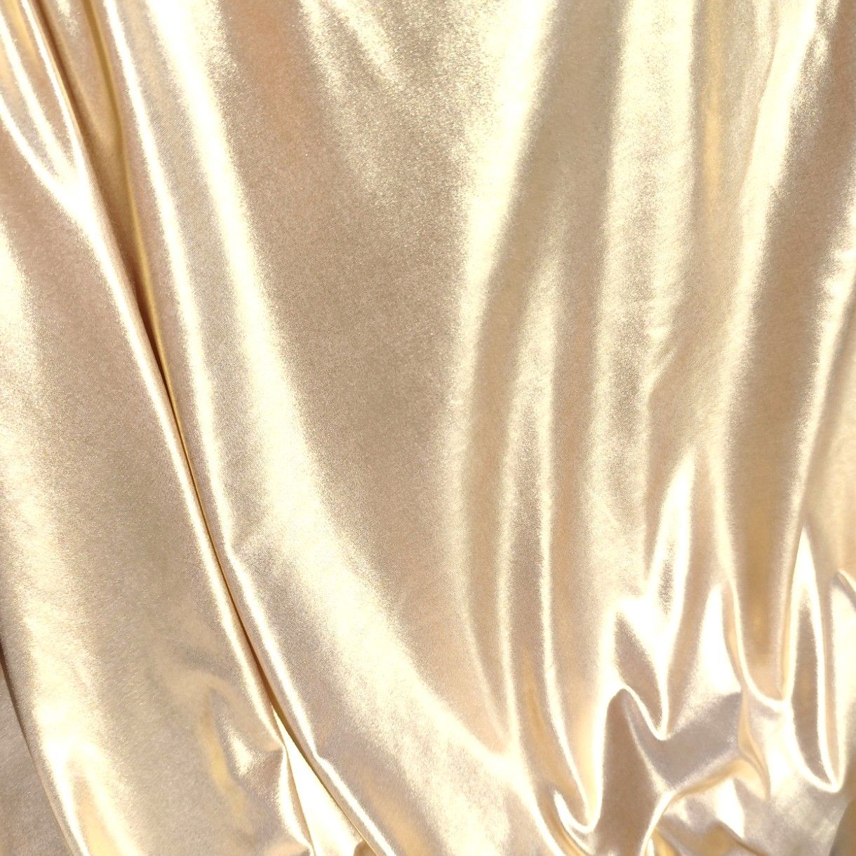 Metallic light gold swimwear fabric from the Lumière Collection by Nora Chantre.