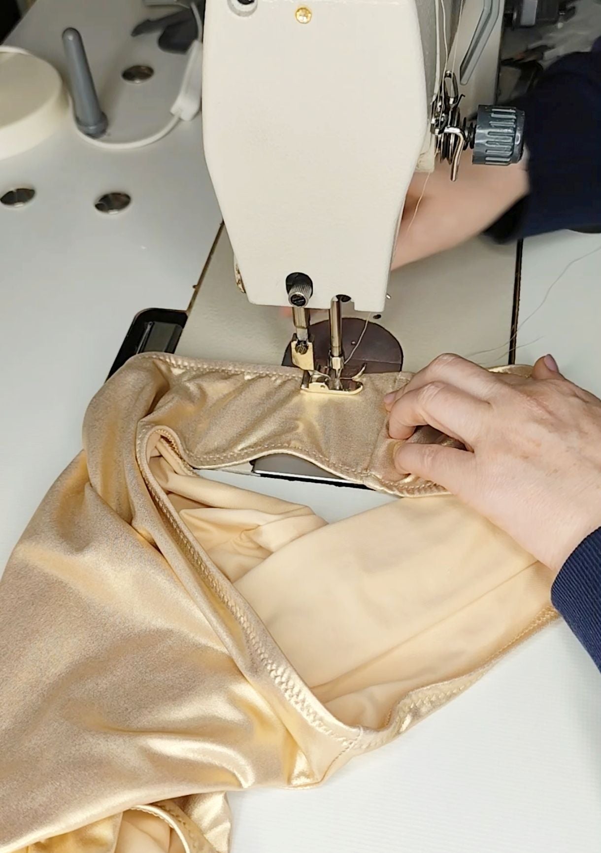Sewing a metallic swimsuit in the Nora Chantre swimwear atelier.