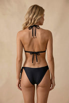 Back view of Seraya black asymmetric bikini showing tie straps